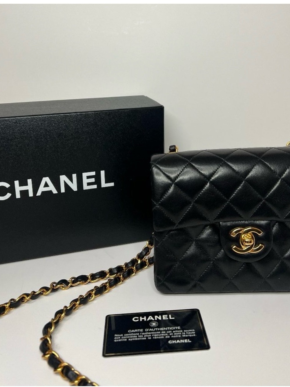 CHANEL Black Quilted Leather Mini Flap Bag with Gold Chain